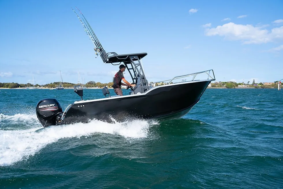Aluminum center-console fishing boat underway with an angler aboard