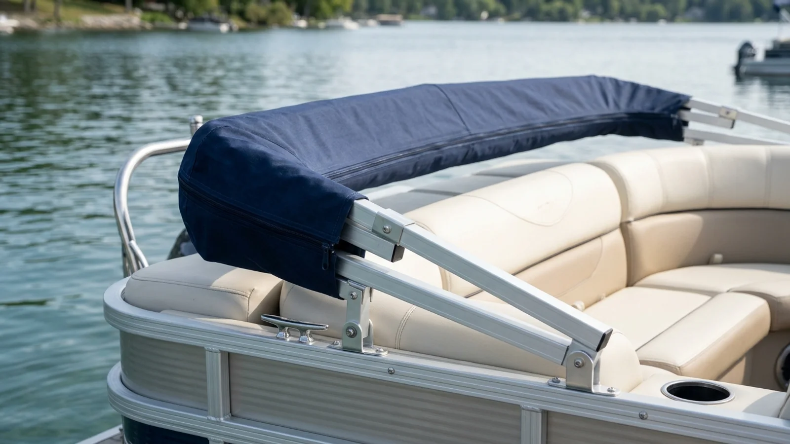 Stern view of an aluminum pontoon boat with the square-tube bimini frame folded back onto rear struts and enclosed in a zippered storage boot